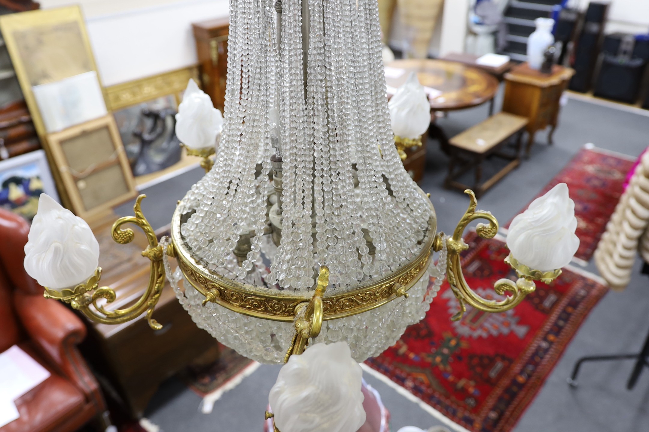 A cut and beaded glass and ormolu bag chandelier, approx 96cms high, approx 75cm diameter